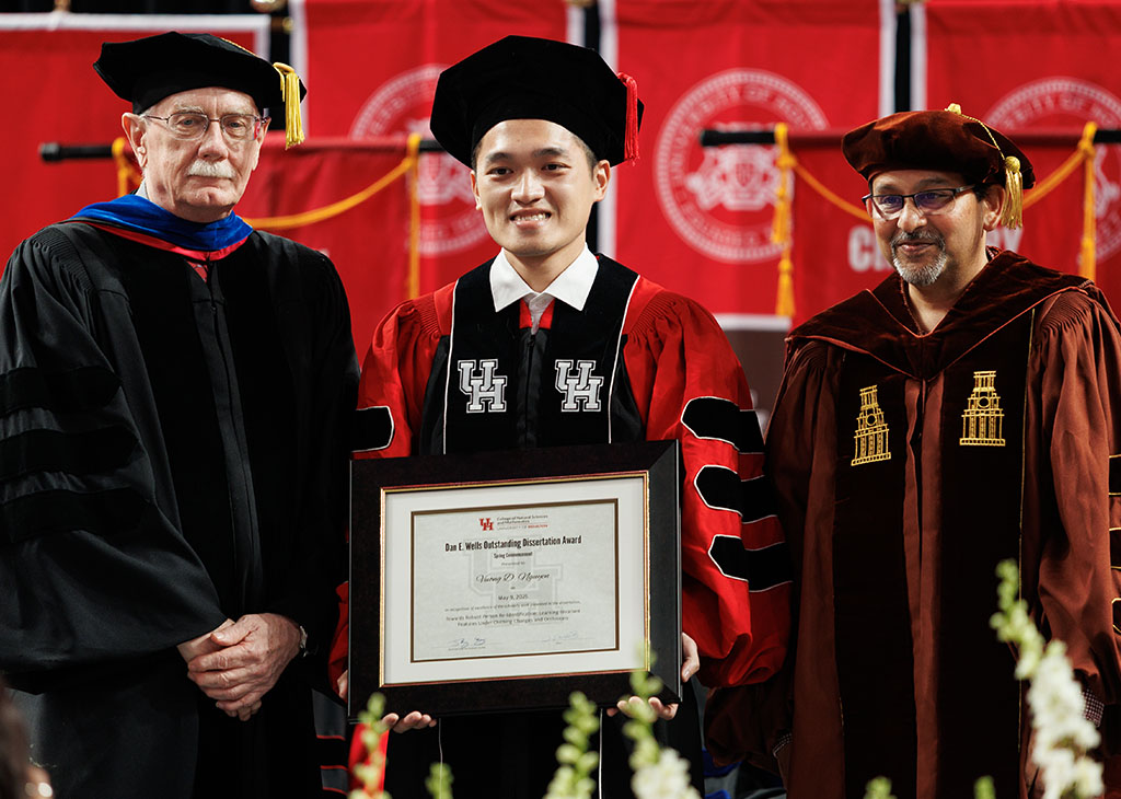 Dan E. Wells Outstanding Dissertation Award winner Vuong Dustin Nguyen with Dean Dan Wells (left) and his advisor Shishir Shah (right).
