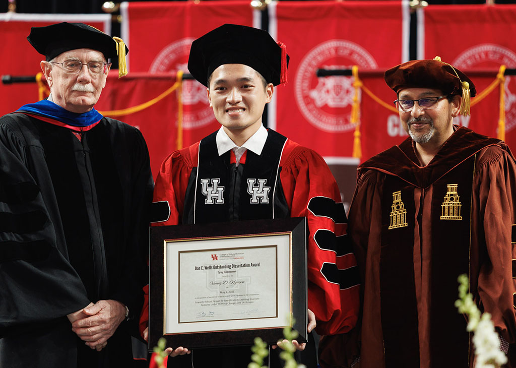 Dan E. Wells Outstanding Dissertation Award winner Vuong Dustin Nguyen with Dean Dan Wells (left) and his advisor Shishir Shah (right).