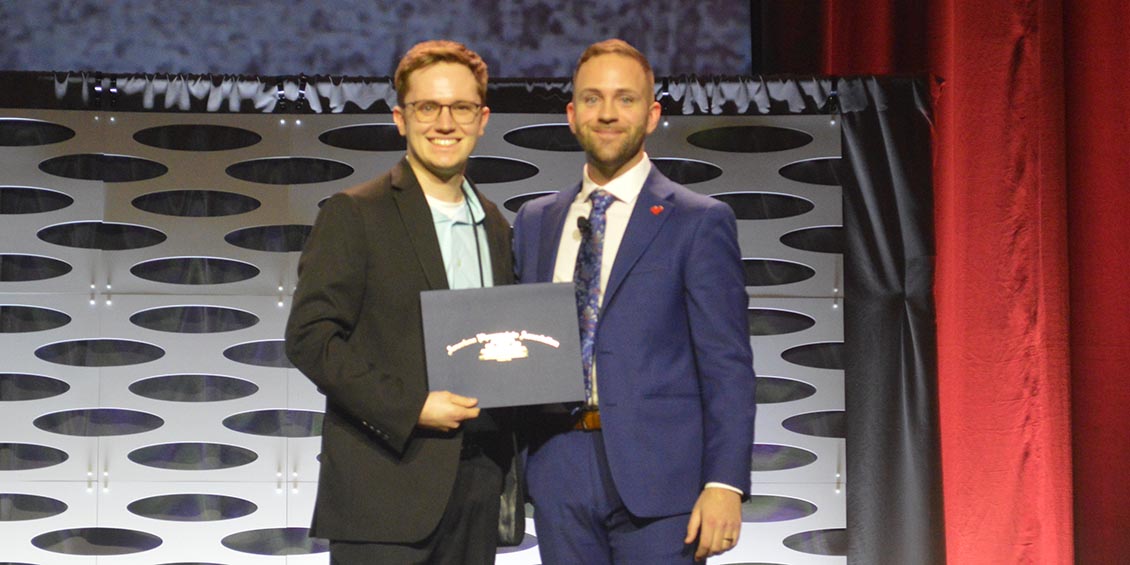 Hunter Adam receiving certificate
