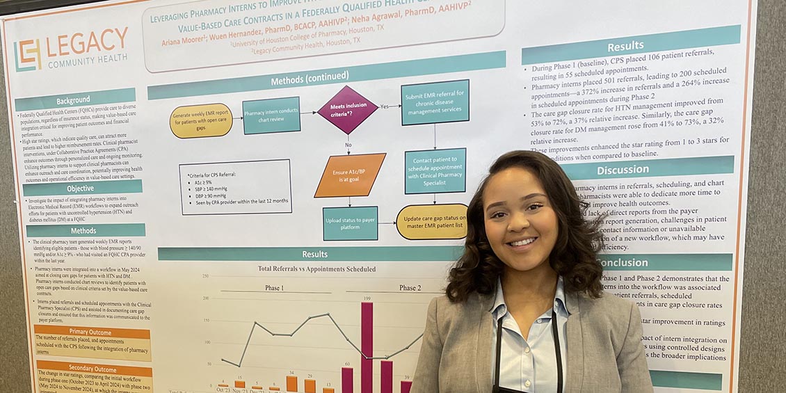 Ariana Moorer next to her research poster