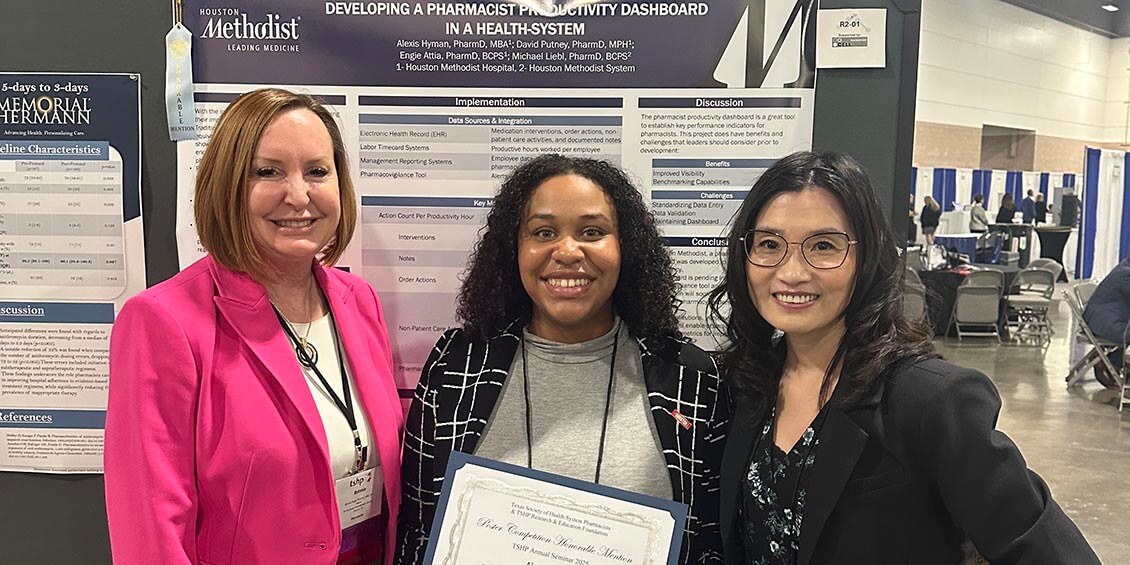 Hyman and TSHP representatives at poster