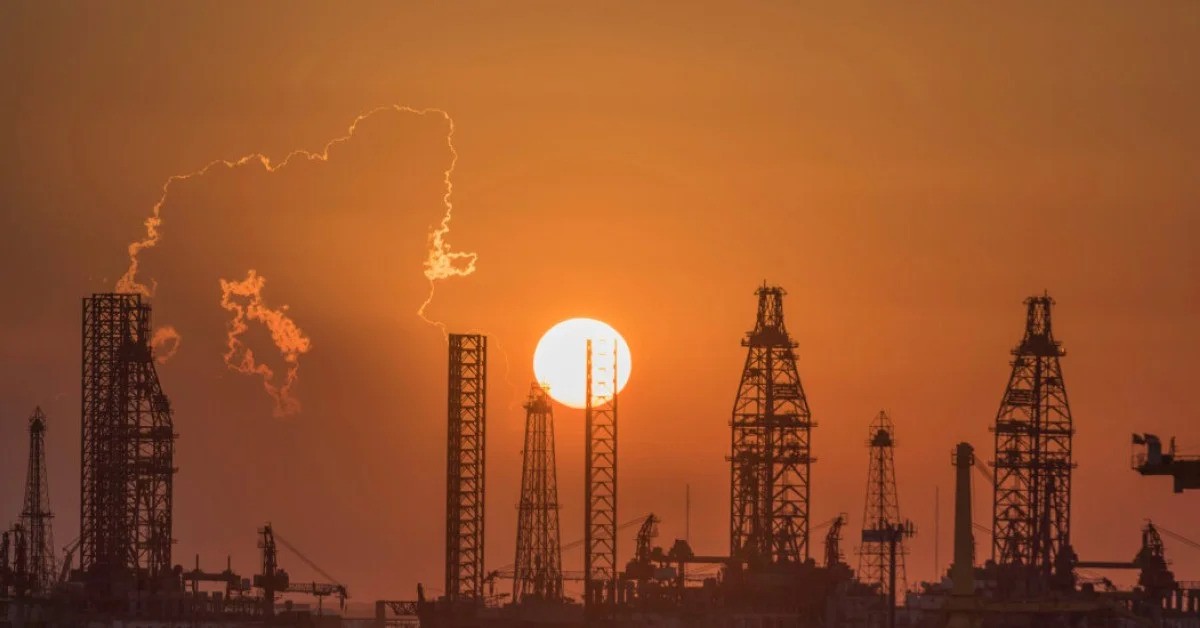 Houston's skyline juxtaposed with oil rigs